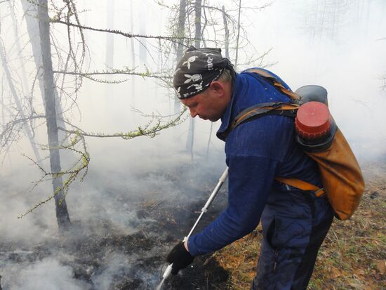 Fire crews battle wildfires in Yakutsk