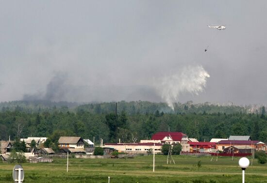 Helicopter extinguishes fire at military deport in Udmurtia