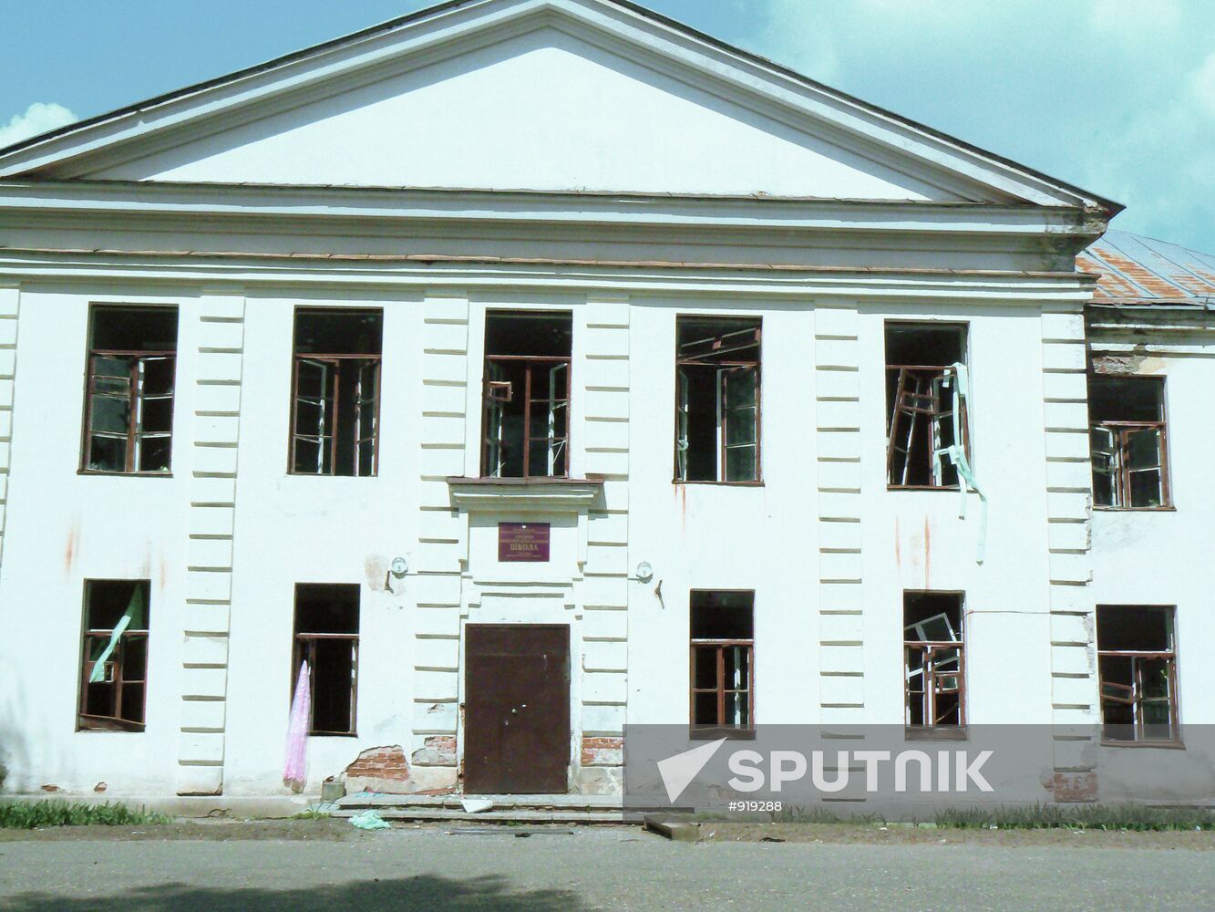 Secondary school building with broken windows