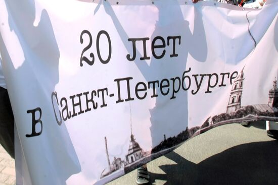 Procession honors 20th anniversary of return of historic name