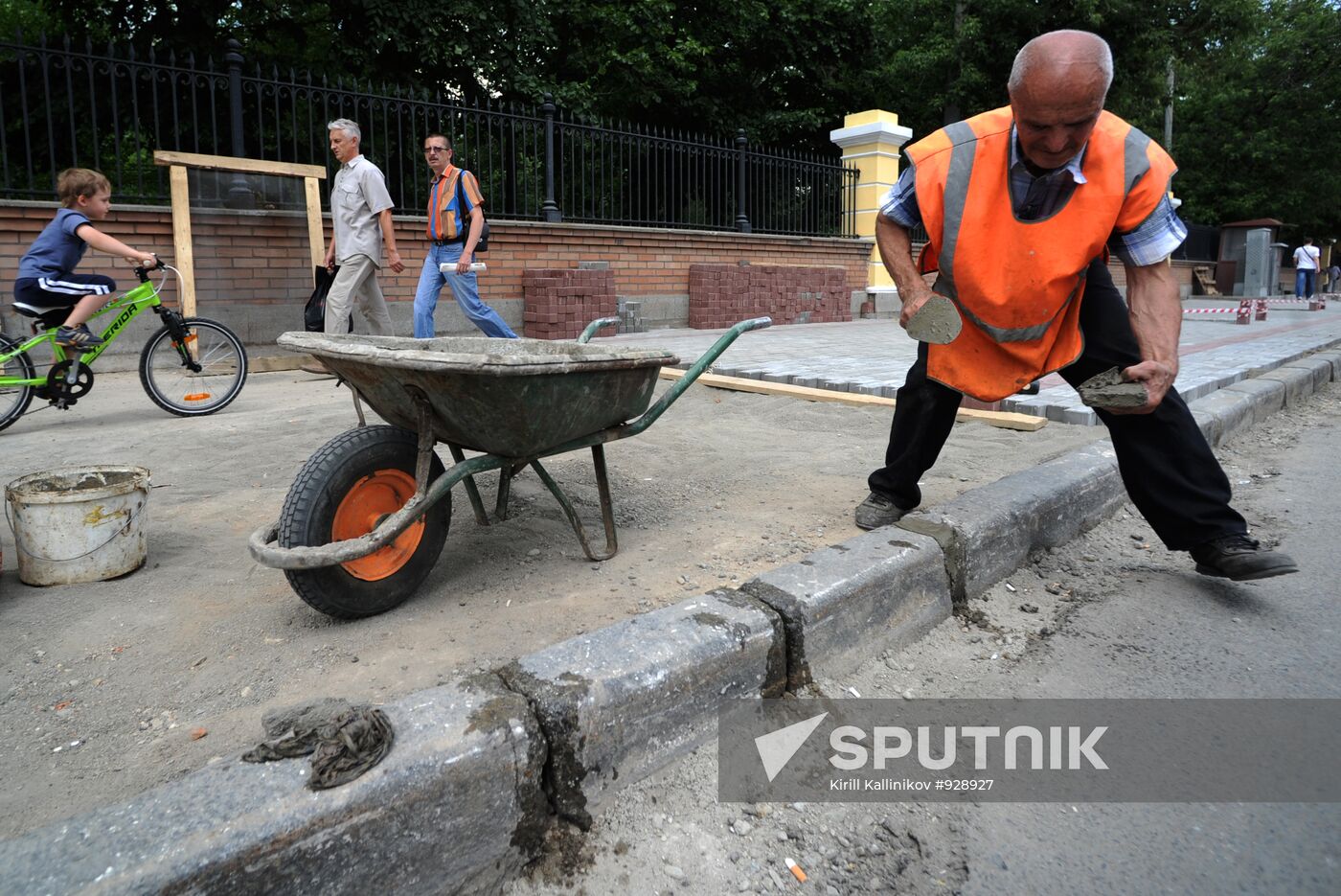 Moscow maintenance workers replace paving stones