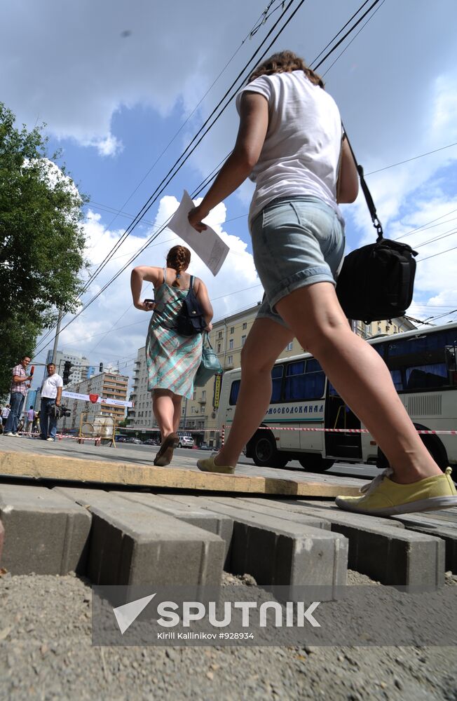 Moscow maintenance workers replace paving stones