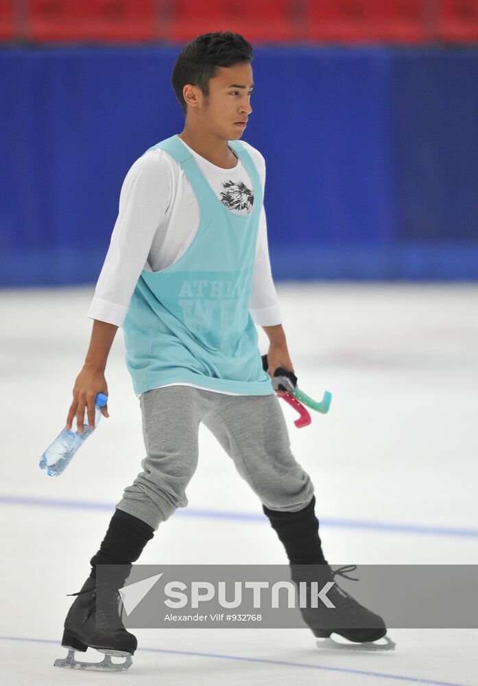 Coach Nikolai Morozov holds training session with his skaters