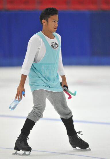 Coach Nikolai Morozov holds training session with his skaters