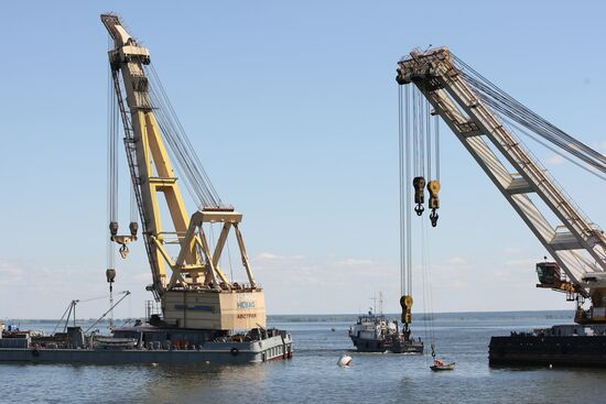 Two floating cranes preparing to lift the ship "Bulgaria"