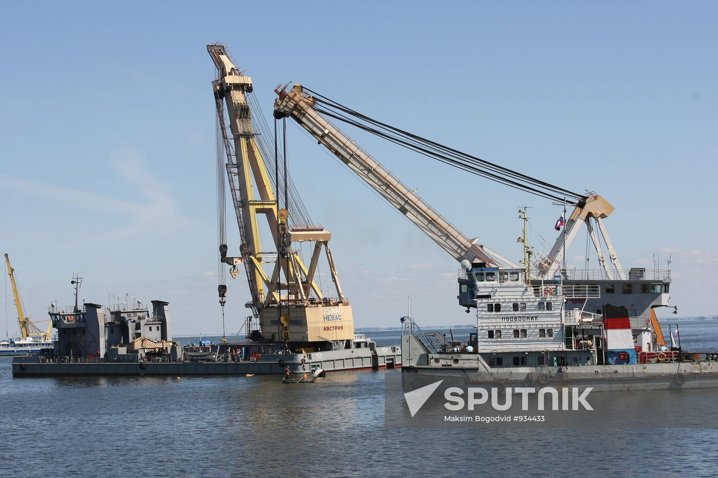 Two floating cranes prepare to raise the ship "Bulgaria"