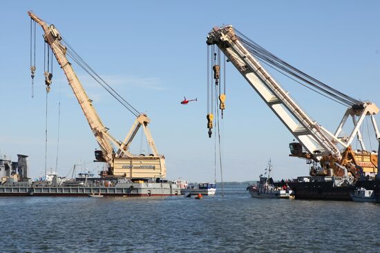 Two floating cranes preparing to lift the ship "Bulgaria"