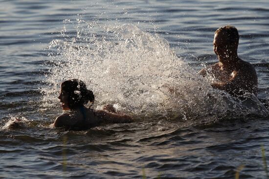 Shuya residents bathe in Teza River