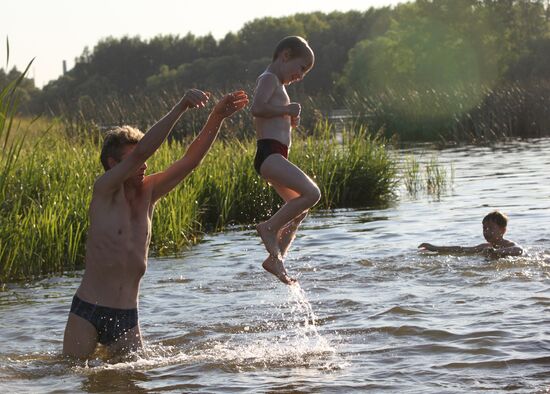 Shuya residents bathe in Teza River