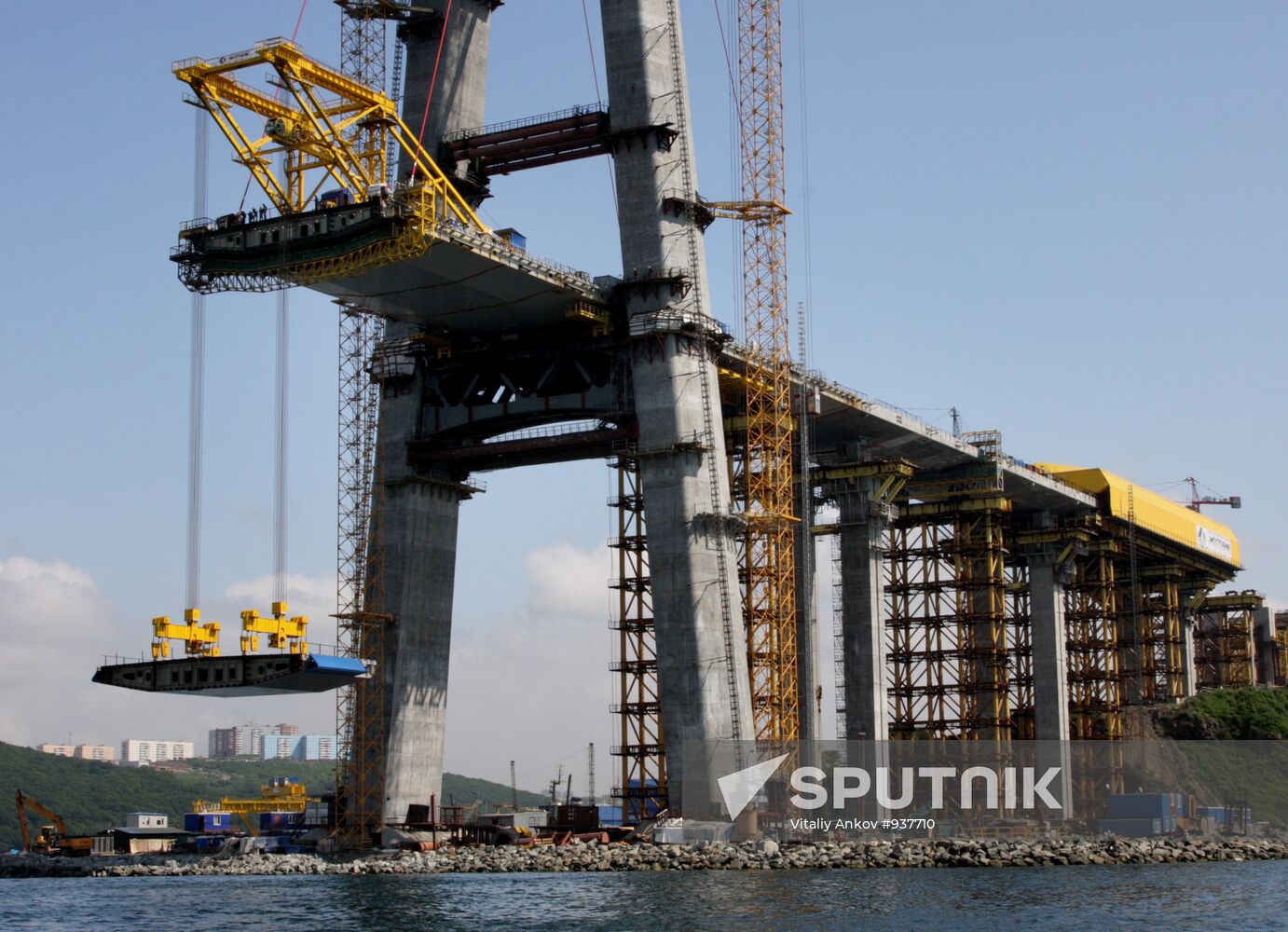 Panel of bridge to Russky Island is lifted from water