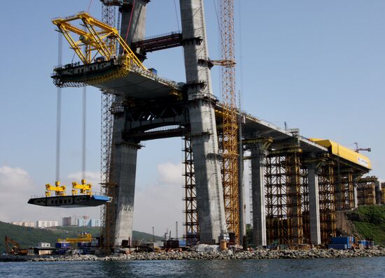 Panel of bridge to Russky Island is lifted from water