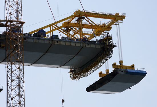 Panel of bridge to Russky Island is lifted from water
