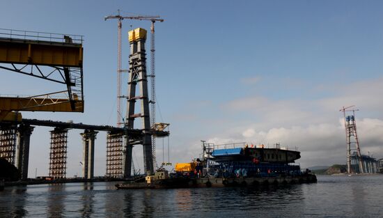 Panel of bridge to Russky Island is lifted from water