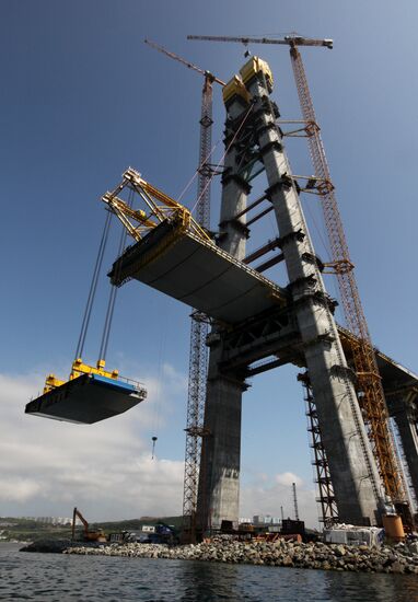 Panel of bridge to Russky Island is lifted from water