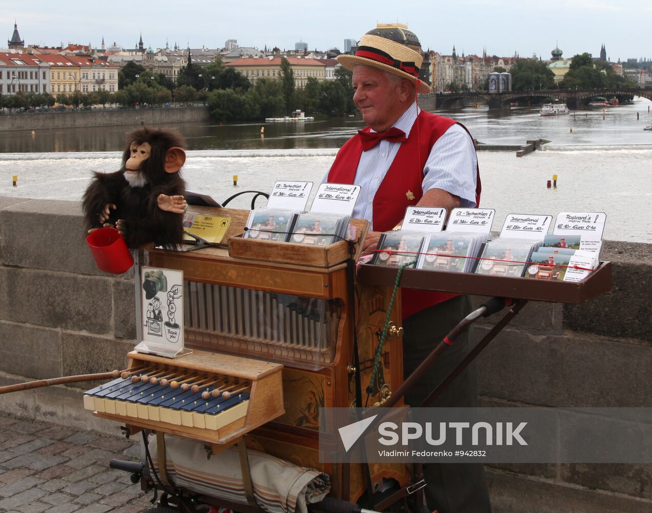 Organ grinder seen on Charles Bridge in Prague
