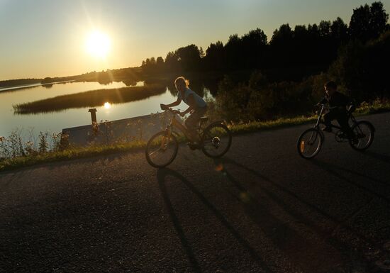 Young cyclists in the village of Ferapontovo