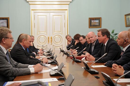 Vladimir Putin meets with David Cameron