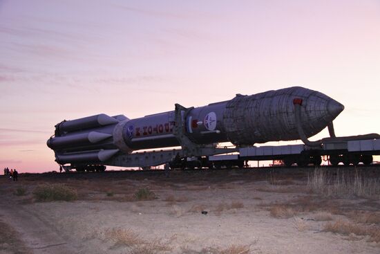 Proton-M with Kosmos satellite transported to launch pad