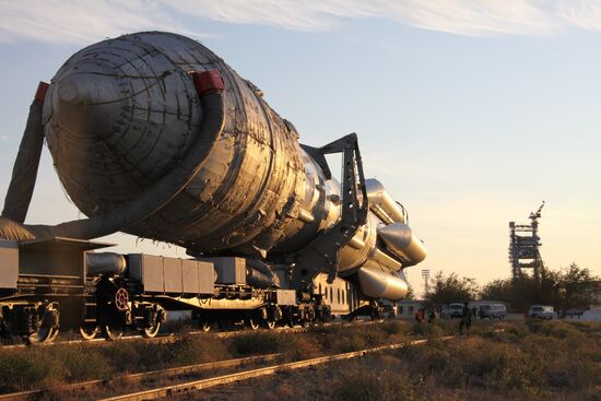 Proton-M with Kosmos satellite transported to launch pad