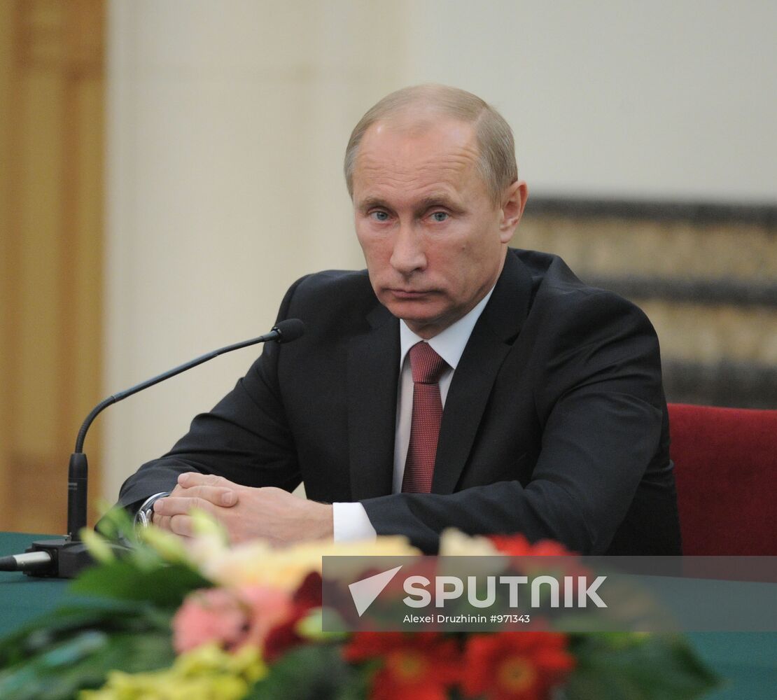 Vladimir Putin visits China
