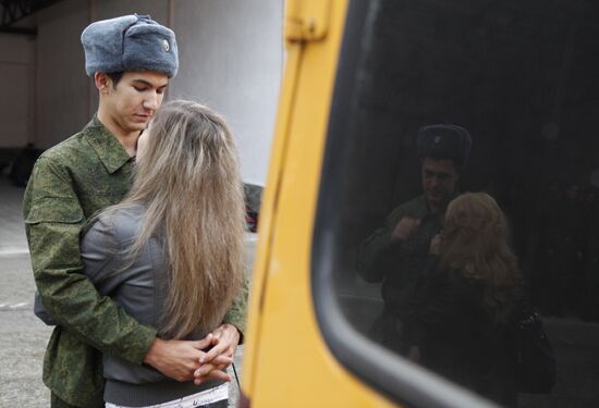 Conscripts leave for military service from recruit depot