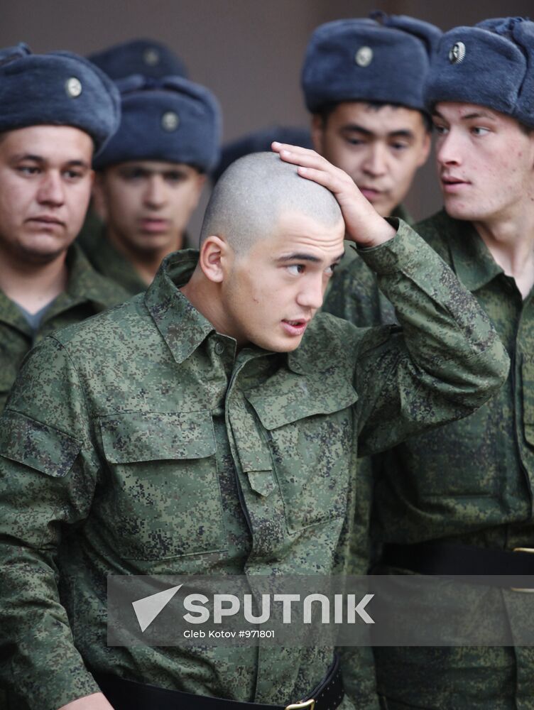 Conscripts leave for military service from recruit depot