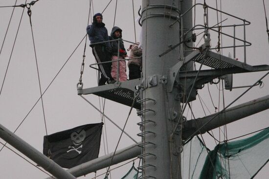 Pirate flag "Jolly Roger" is hung on cruiser "Aurora"