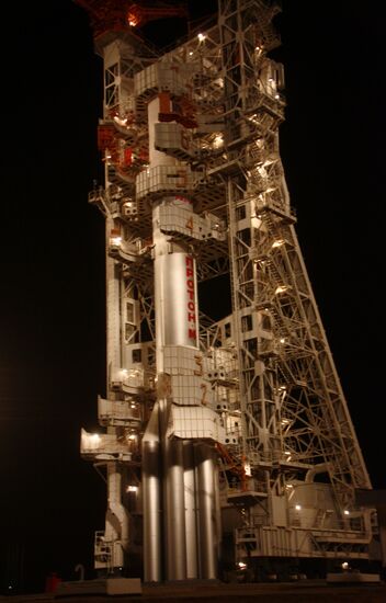 Proton-M rocket with ViaSat-1 satellite being erected