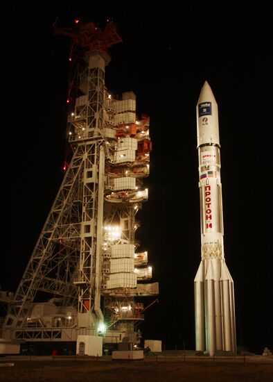 Proton-M rocket with ViaSat-1 satellite being erected