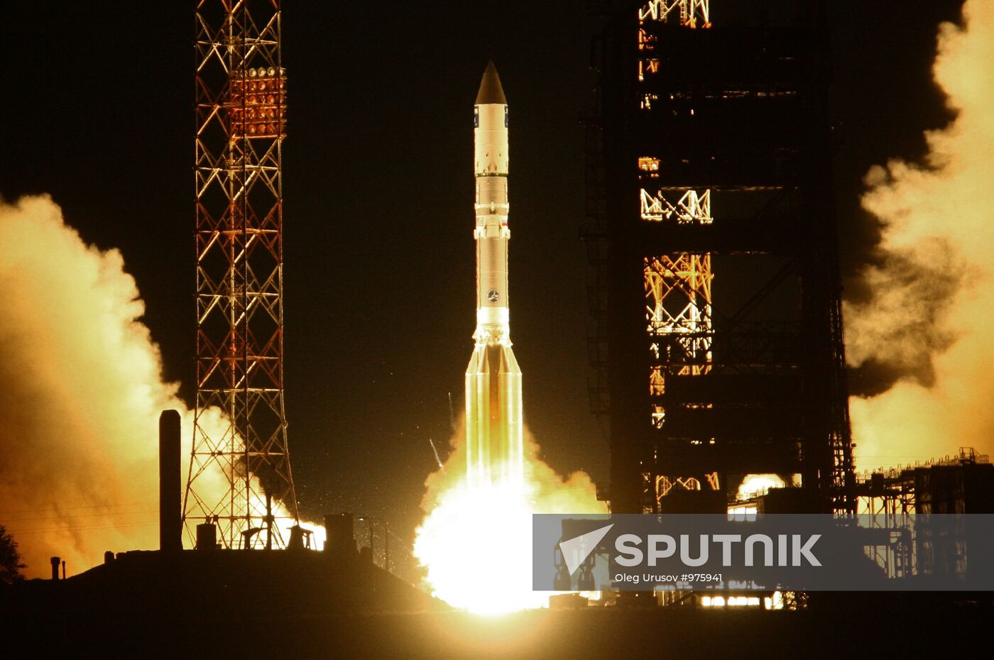 Proton-M rocket with ViaSat-1 satellite being erected