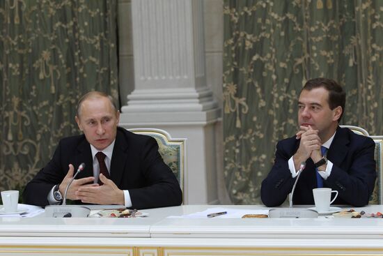 D.Medvedev and V.Putin meeting with retirees and veterans