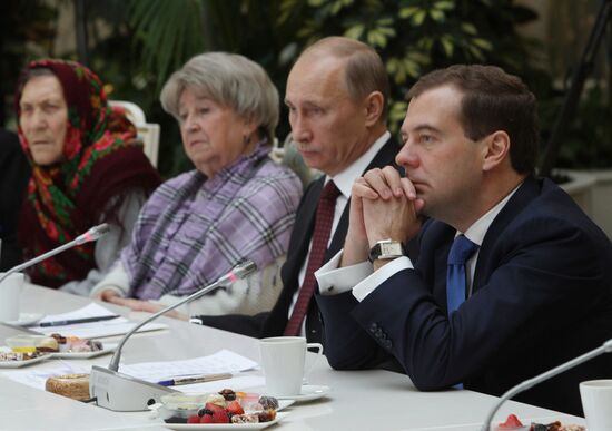 D.Medvedev and V.Putin meeting with retirees and veterans