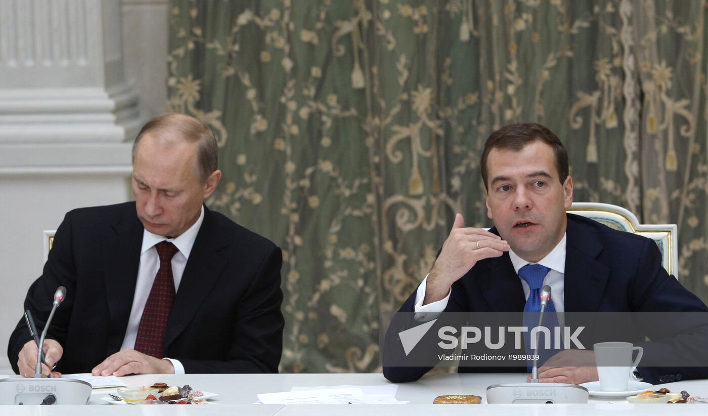 D.Medvedev and V.Putin meeting with retirees and veterans
