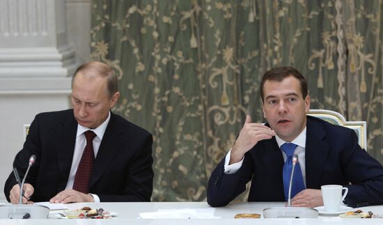 D.Medvedev and V.Putin meeting with retirees and veterans