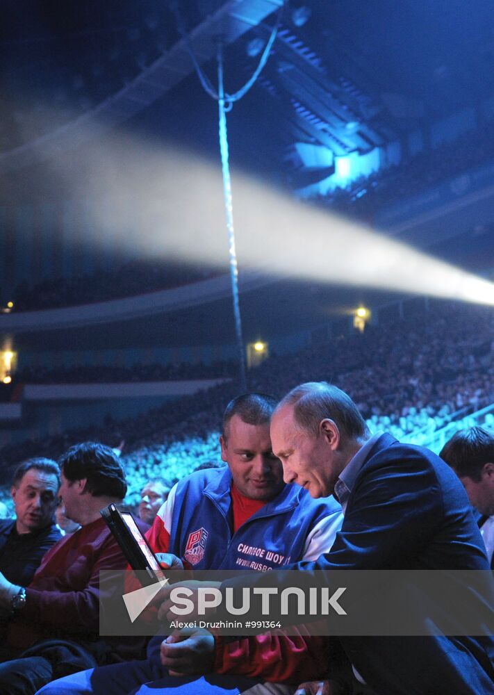 Vladimir Putin attends M-1 Global mixed martial arts competition