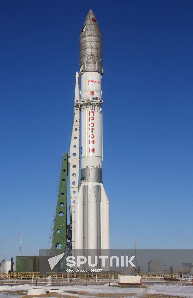 Proton missile with AsiaSat 7 satellite carried to launchpad