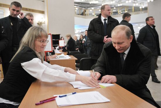 Vladimir Putin takes part in State Duma elections