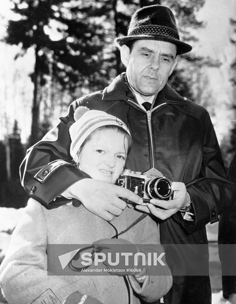 Soviet pilot-cosmonaut Vladimir Komarov and his daughter walking ...