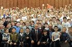 January 7, 2014. Russian President Vladimir Putin, center, is photographed with members of the Combined Children's Choir of Russia during a visit to choir practice in the new building of the Mariinsky Theatre in St. Petersburg. Location: Russia, . Author: Mikhail Klimentyev/Sputnik. Vladimir Putin's working visit to St. Petersburg