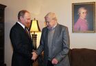 January 7, 2014. Russian President Vladimir Putin, left, congratulates writer Daniil Granin, 95 years old as of January 1, in his new apartment on Vasilevsky Island in St. Petersburg. Location: Russia, . Author: Mikhail Klimentyev/Sputnik. Vladimir Putin's working visit to St. Petersburg