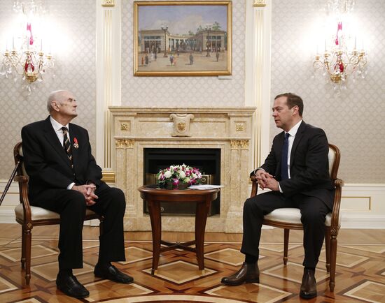 Russian Prime Minister Dmitry Medvedev awards the Order of Alexander Nevsky to Prince Dmitry Romanov