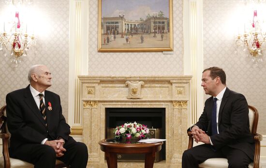 Russian Prime Minister Dmitry Medvedev awards the Order of Alexander Nevsky to Prince Dmitry Romanov