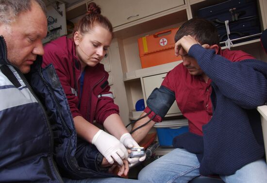 Sailors from sunk floating crane receive treatment on land
