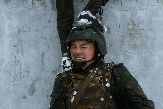 Test for right to wear crimson and green beret by National Guard servicemen