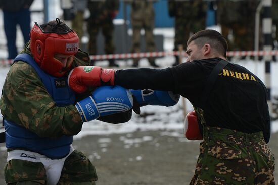 Test for right to wear crimson and green beret by National Guard servicemen