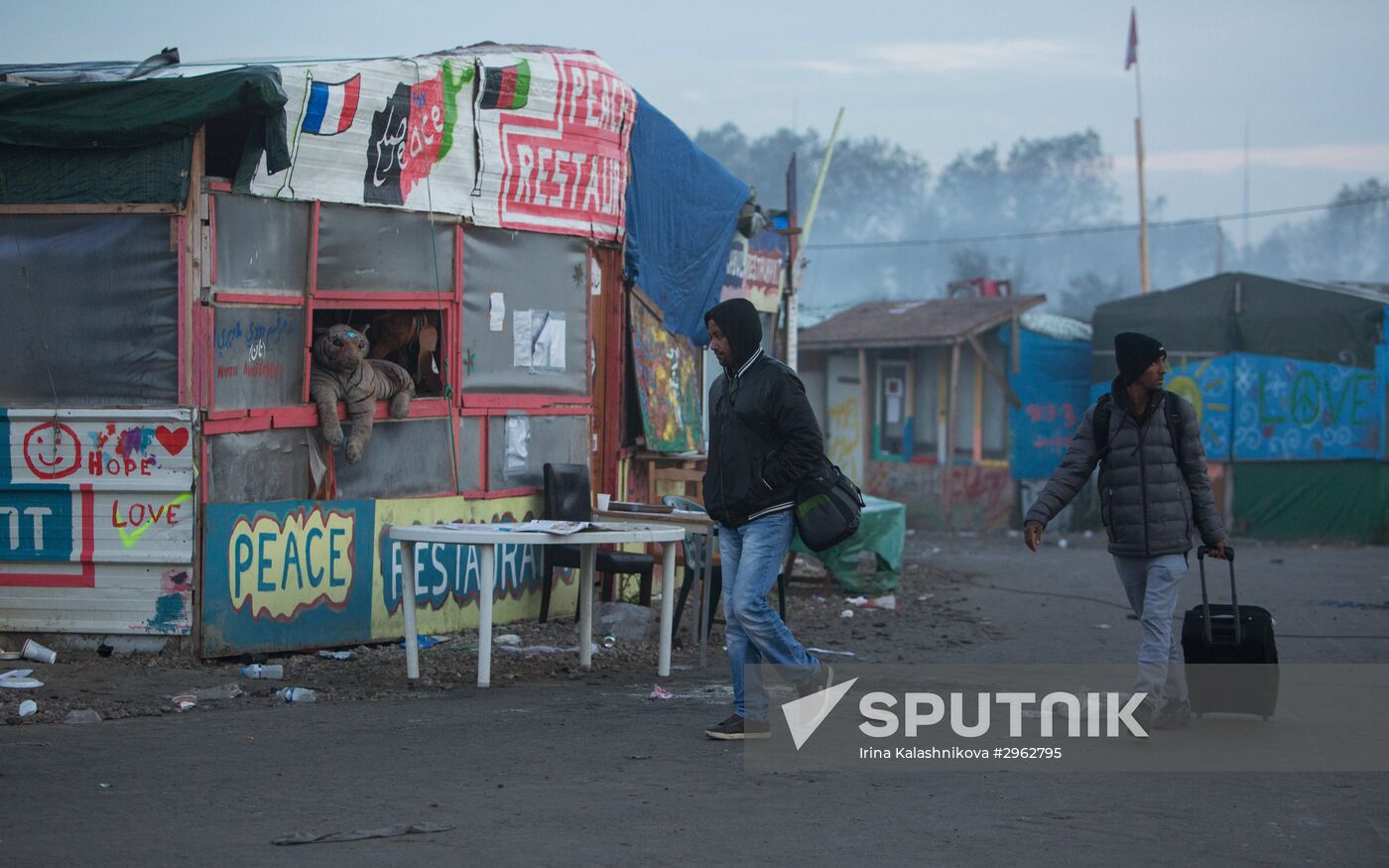 Relocation continues at Jungle spontaneous refugee camp in Calais, France