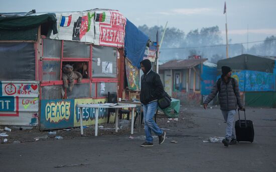 Relocation continues at Jungle spontaneous refugee camp in Calais, France