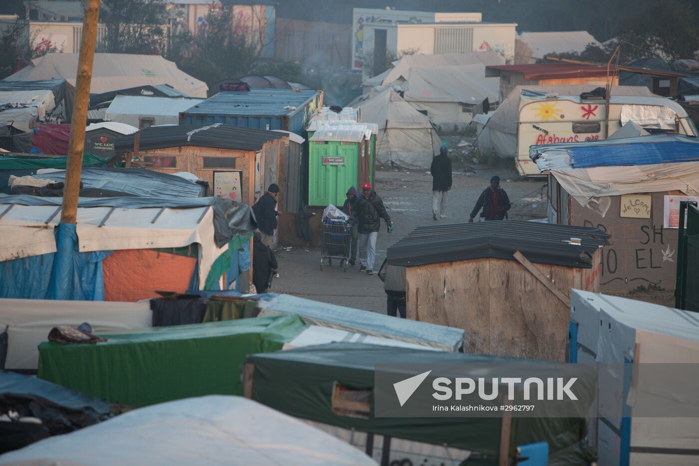 Relocation continues at Jungle spontaneous refugee camp in Calais, France