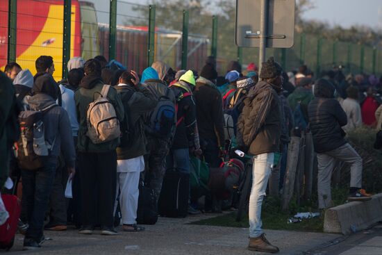 Relocation continues at Jungle spontaneous refugee camp in Calais, France