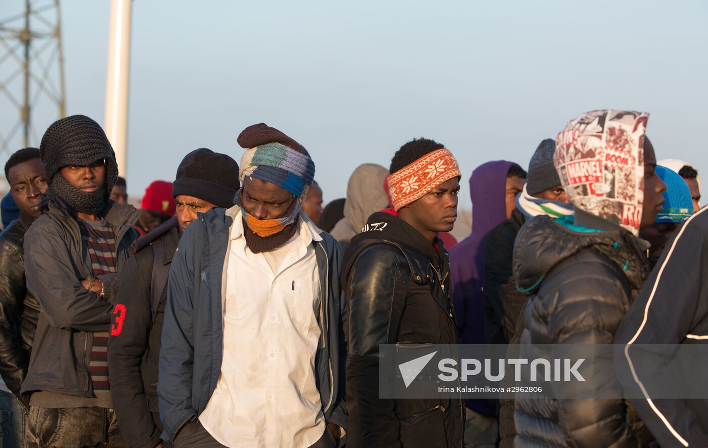 Relocation continues at Jungle spontaneous refugee camp in Calais, France